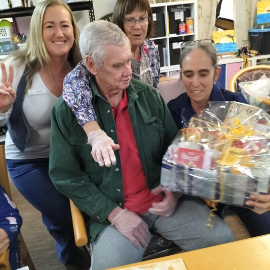 Staff and resident painting together for fun