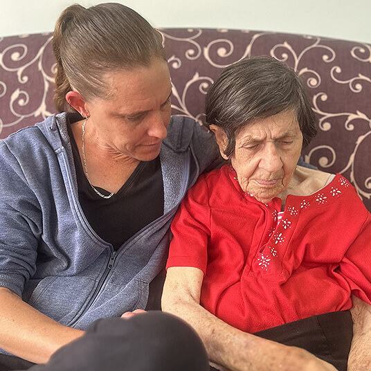 Resident receiving personalised care by staff