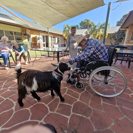 Two residents smiling while spending time together