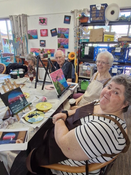 Petting zoo pig being pet by resident