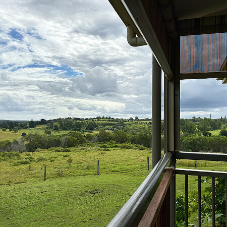 View of green Childers hills from balcony of unit