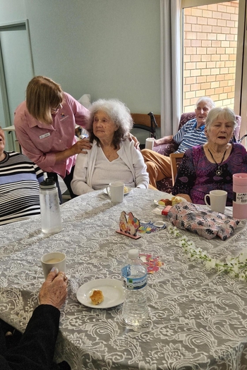 Staff and resident painting together
