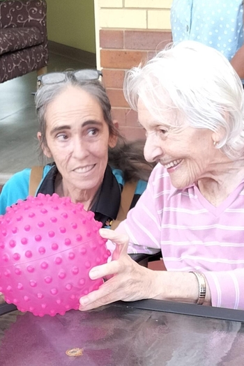 Staff and resident painting together